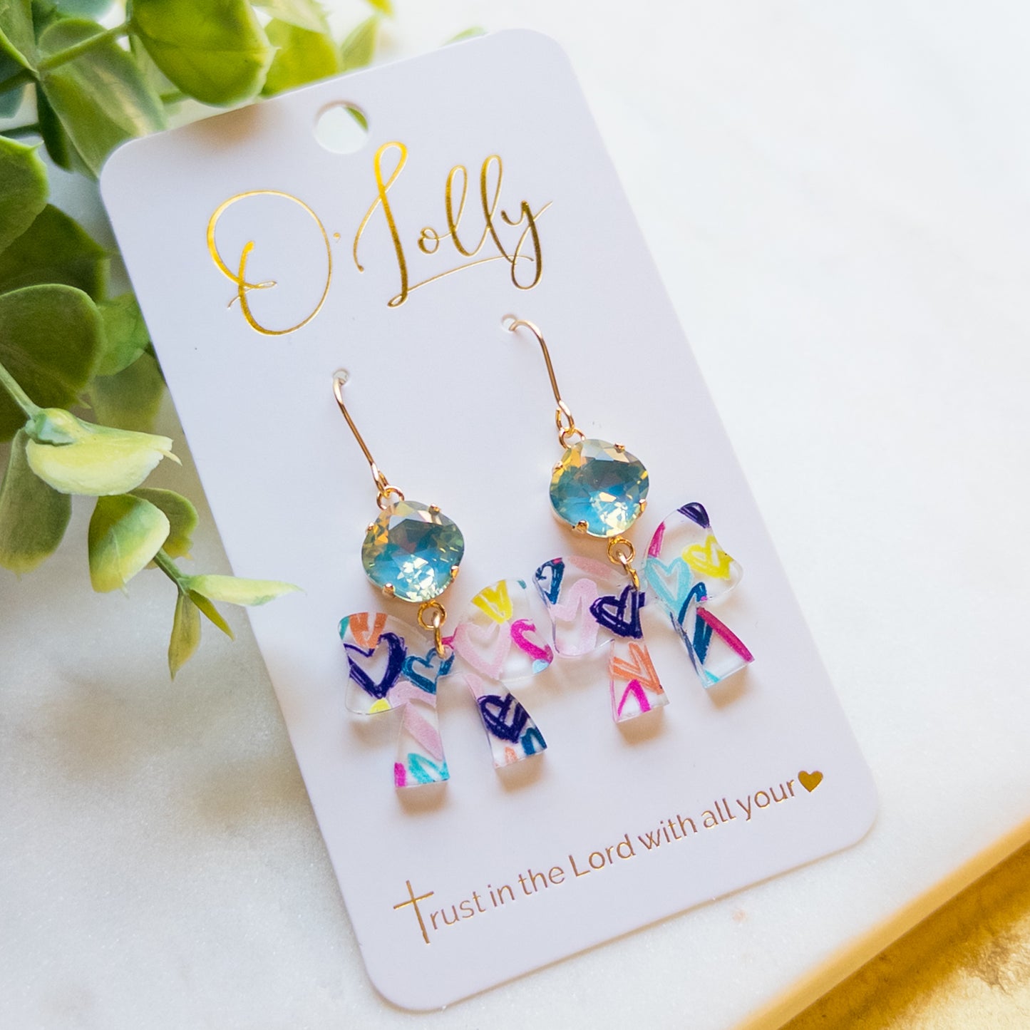 Multicolored Acrylic Bow w/Printed Hearts & Teal Stone “Lovey”