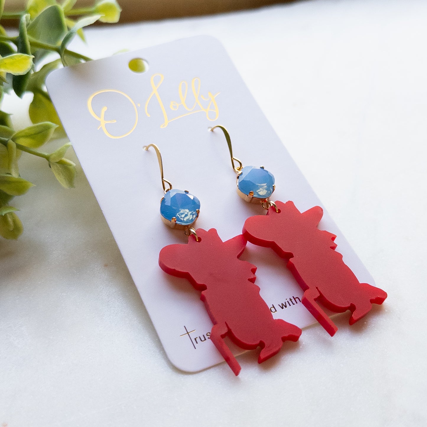 Red Acrylic Rebel Man Earrings w/Blue Stone