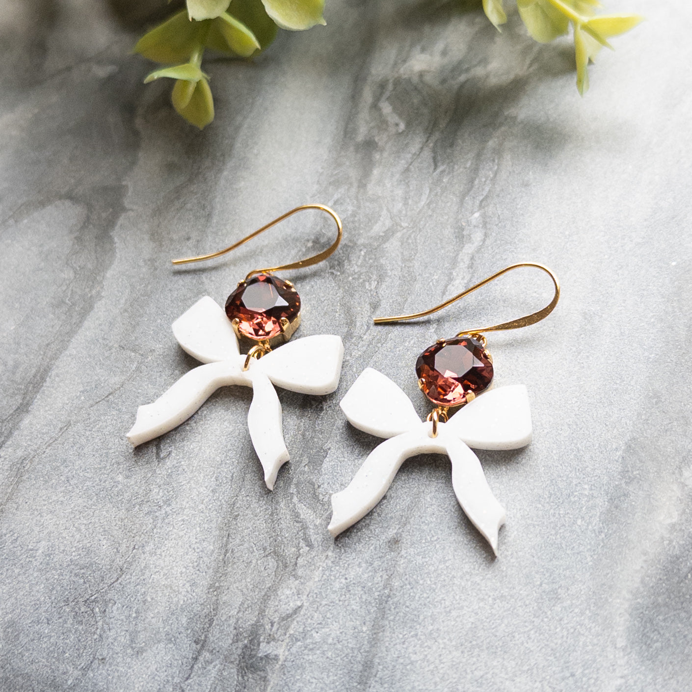 White Bow Earrings w/Maroon Stone