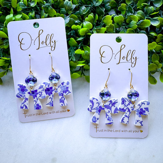 O’Lolly “Anne” Earrings- Blue and White Floral Acrylic Bow with Blue Stone